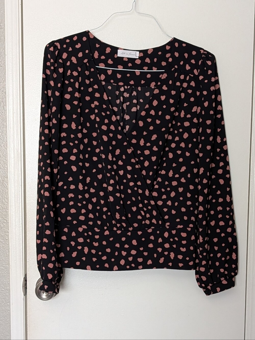All in Favor Black Wrap Blouse with Pink Heart Print